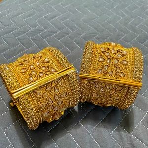 2 gold toned bracelets; open size. New and in great condition. Only worn once.